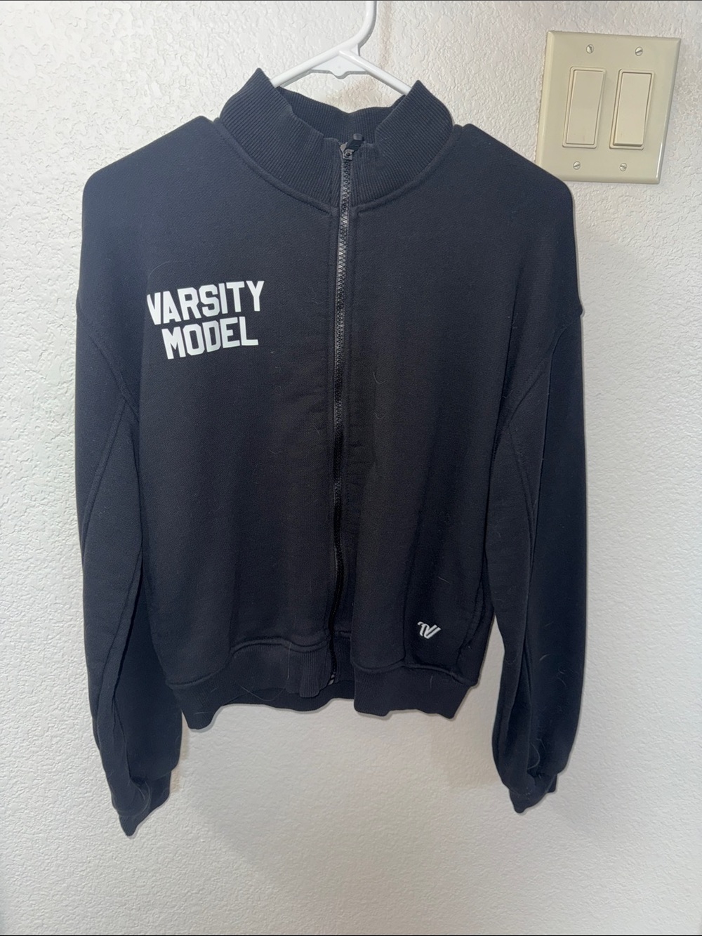 Varsity Spirit Black Zip-Up Jacket with Blue Logo